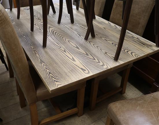 An ash dining table with cast metal base 152 x 90cm